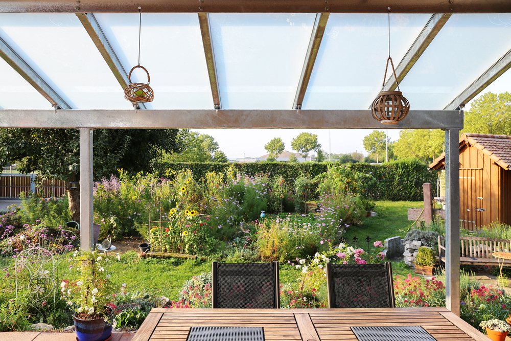 Terrace,With,Glass,Roofing,And,A,View,Of,The,Garden